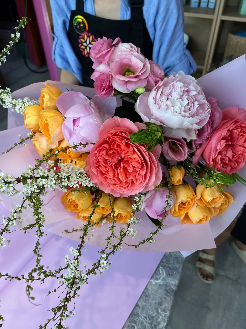 Coral peonies and yellow roses bouquet