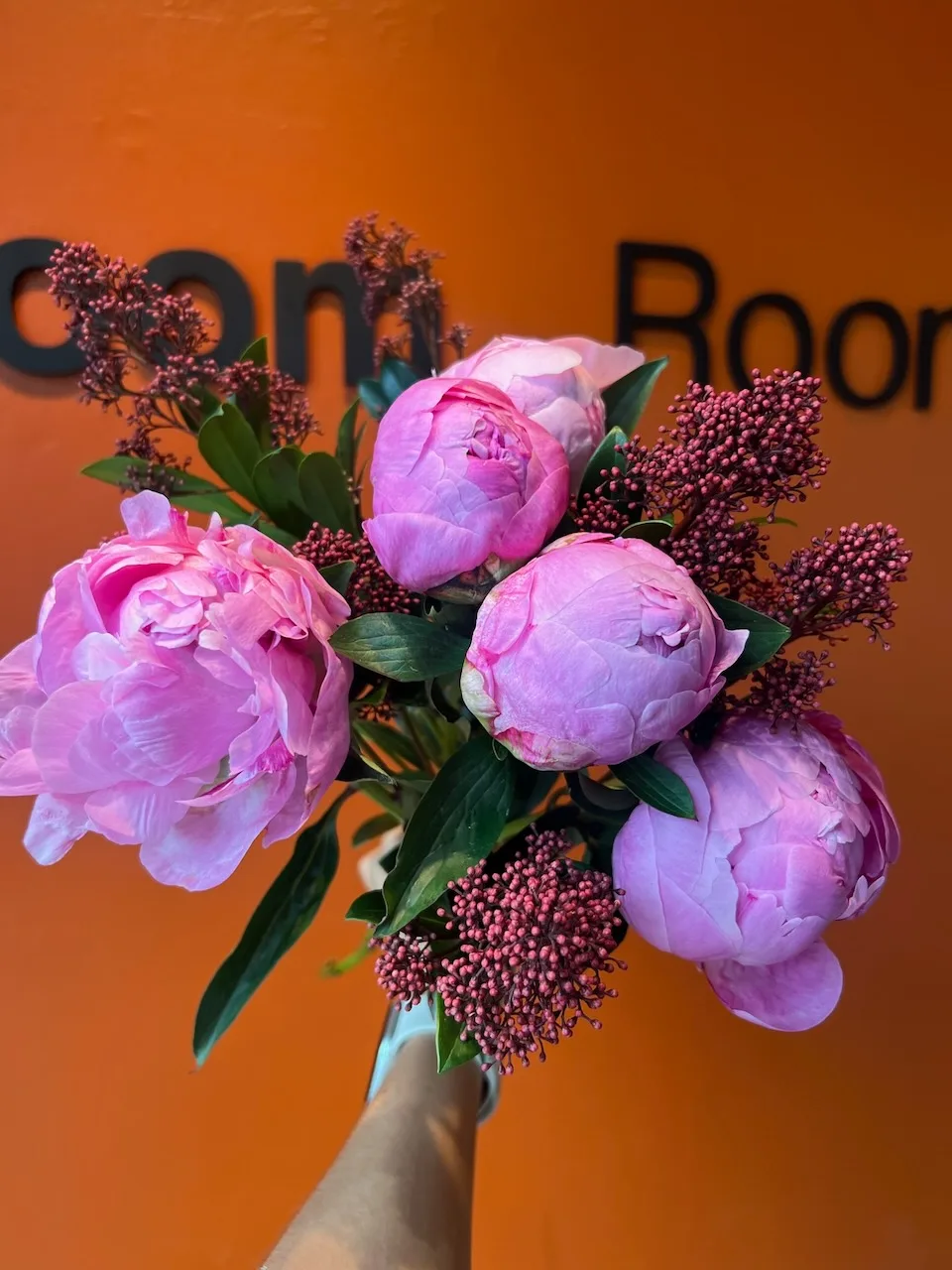 Pink peonies and skimmia bouquet