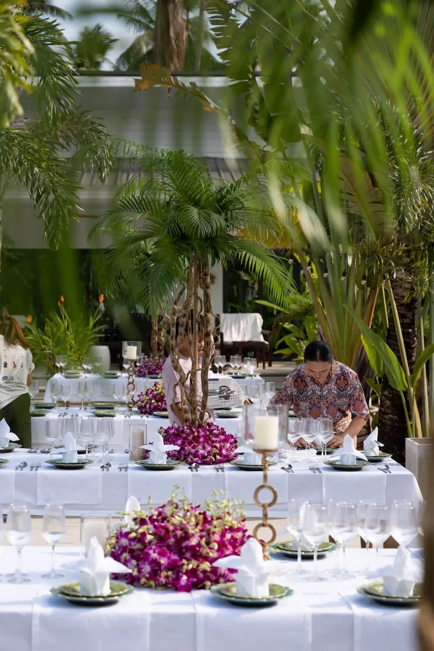Outdoor reception table with orchid centerpieces at a Koh Samui venue